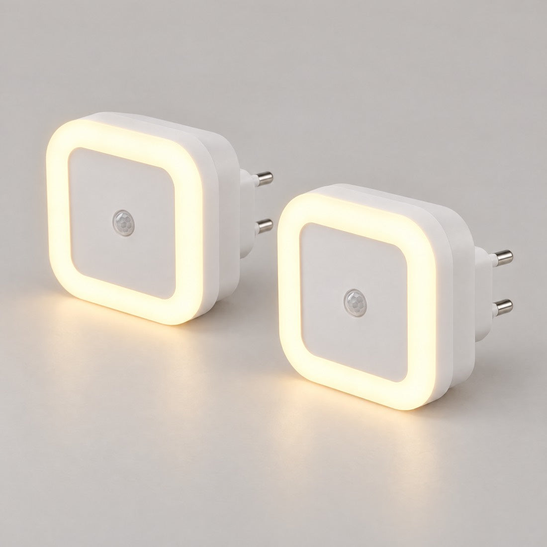 Dos luces nocturnas enchufables